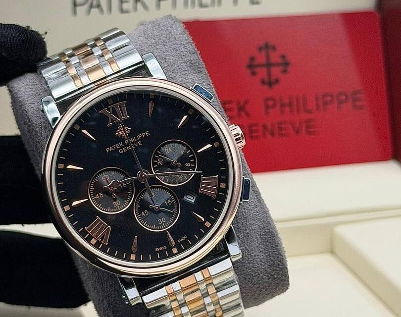 Patek Philippie chronograph watch with elegant chain strap, featuring silver case and black dial