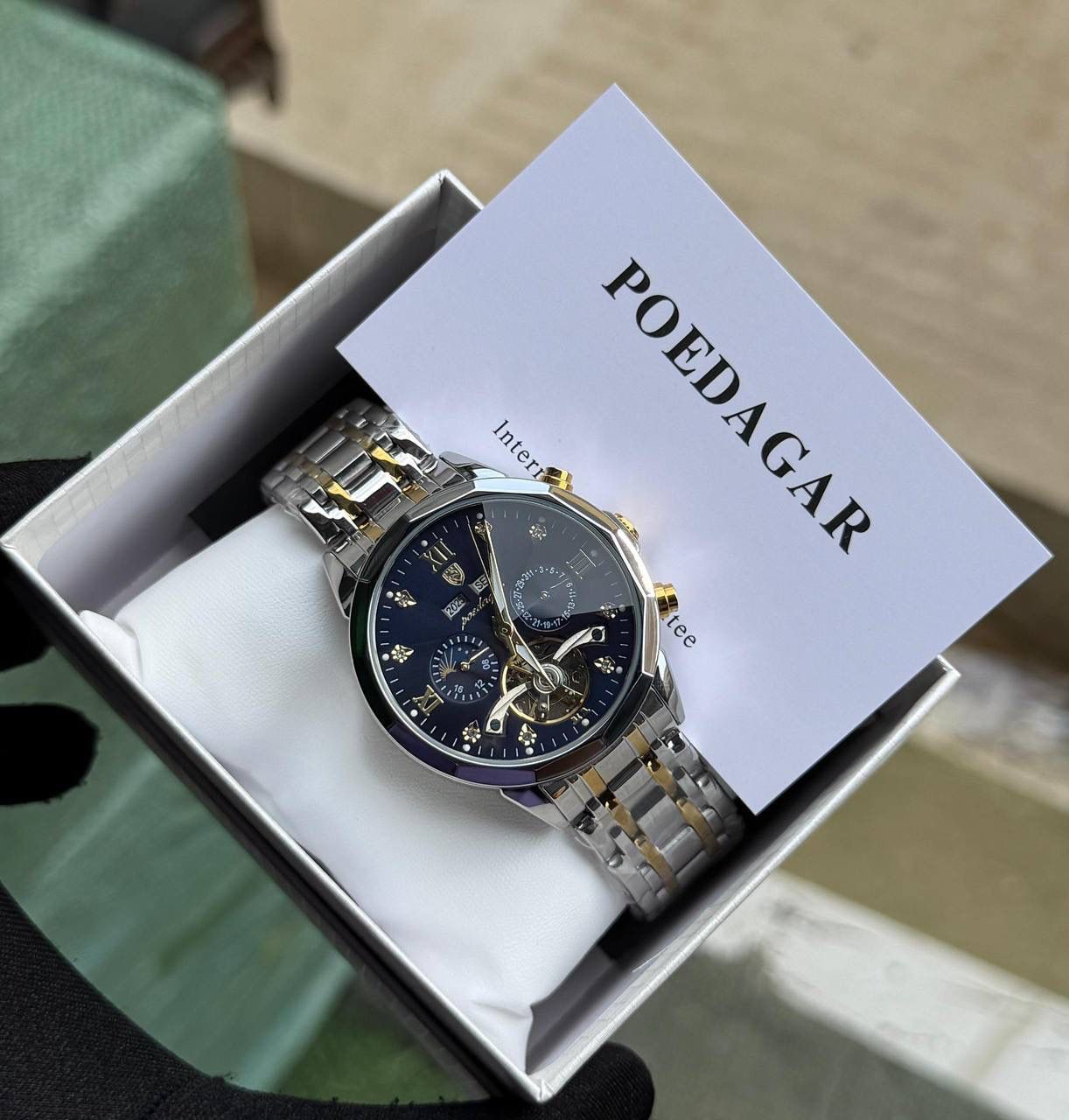 Poedagar automatic chain watch with stainless steel case, sapphire glass, and water‑resistant dial